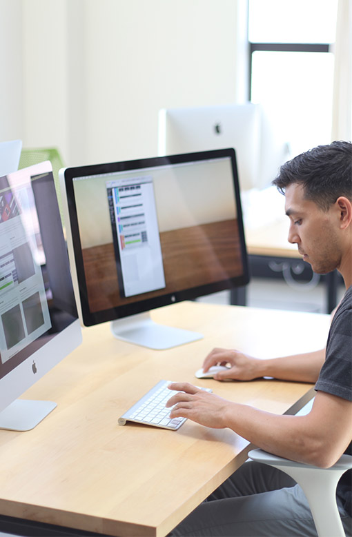 Web developer at desk