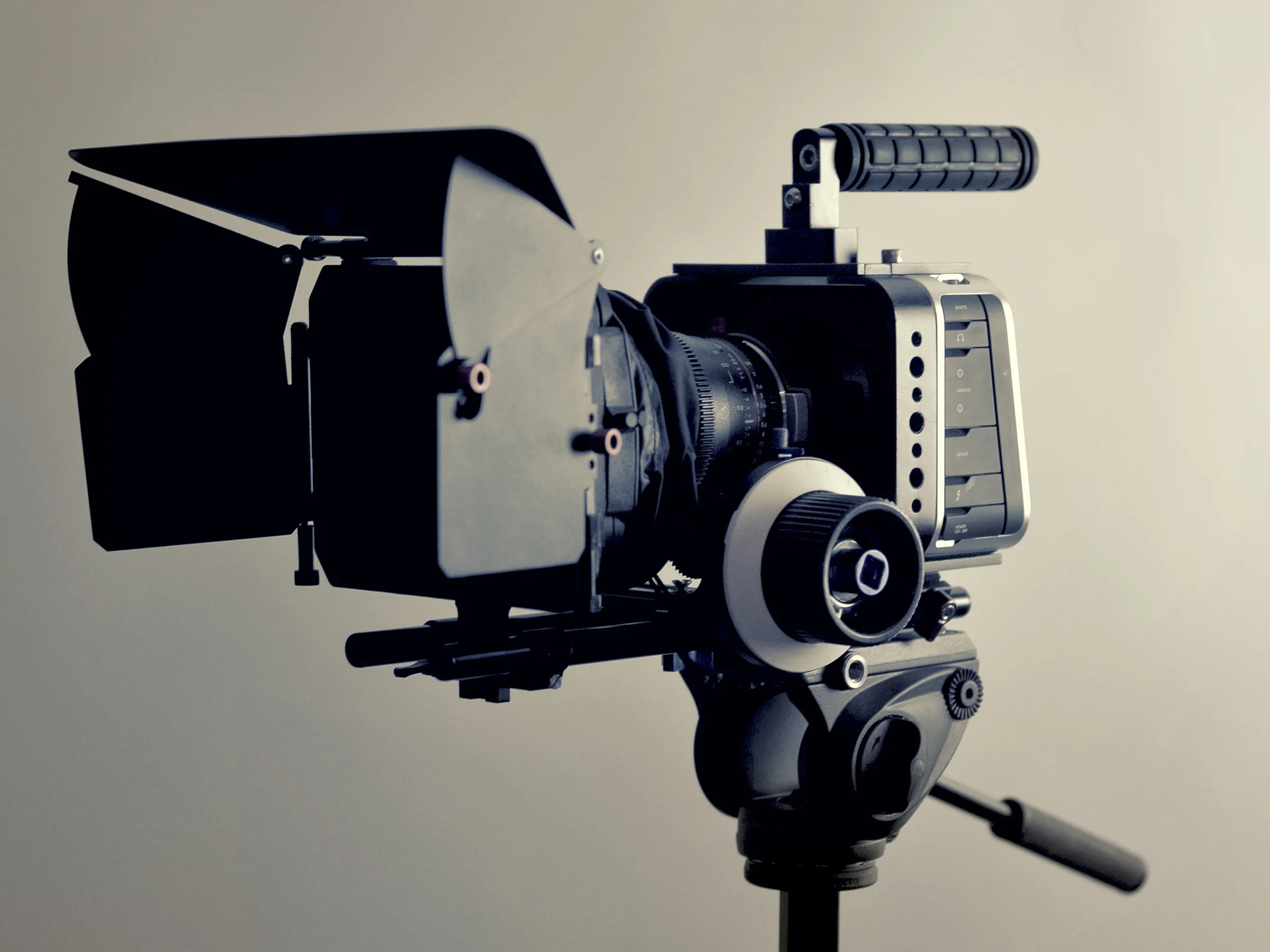 A video camera on a tripod, set up for a shoot